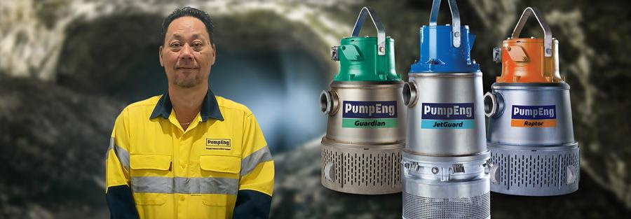 David Choy, PumpEng's new Key Account Manager, standing in a mine next to underwater mine dewatering pumps
