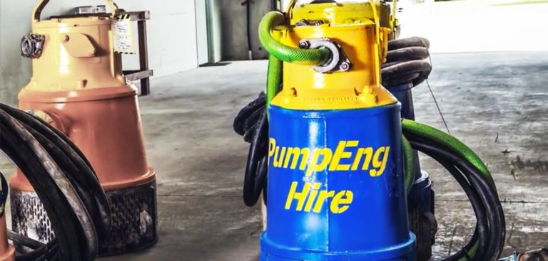 Two pumps, one with 'PumpEng Hire' written on its casing