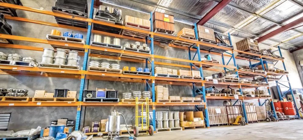 Warehouse shelving containing submersible pump parts