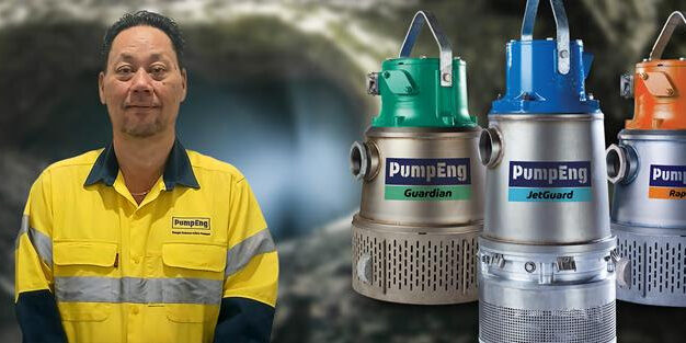 David Choy, PumpEng's new Key Account Manager, standing in a mine next to underwater mine dewatering pumps