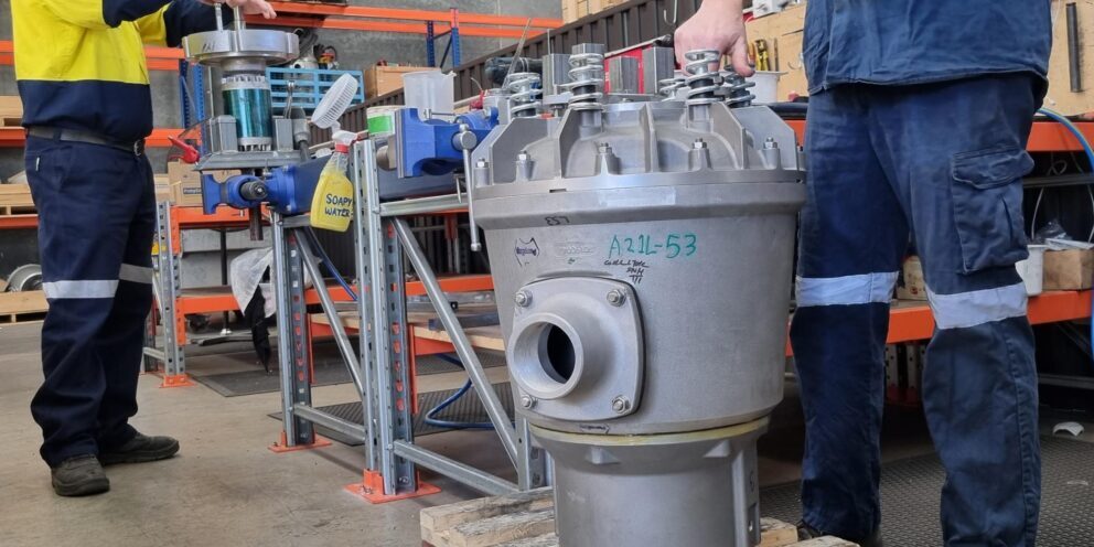 Two PumpEng workers training in the manufacturing of the underground mine submersible pumps